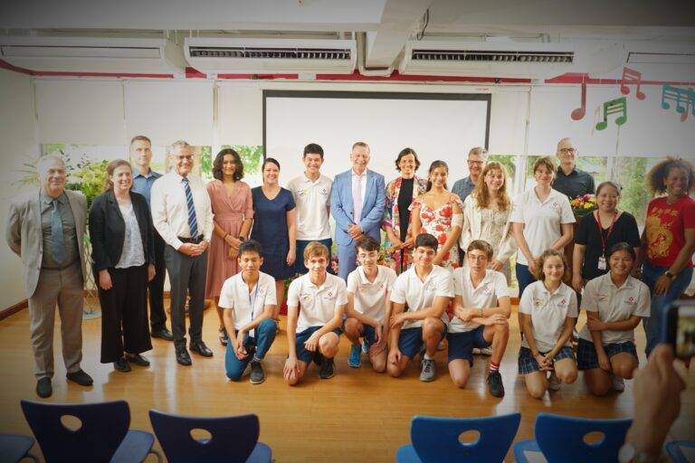 Middle school students receiving Sek 1 diplomas from Deputy German Ambassador Mr. Hans-Ulrich Südbeck in a small ceremony